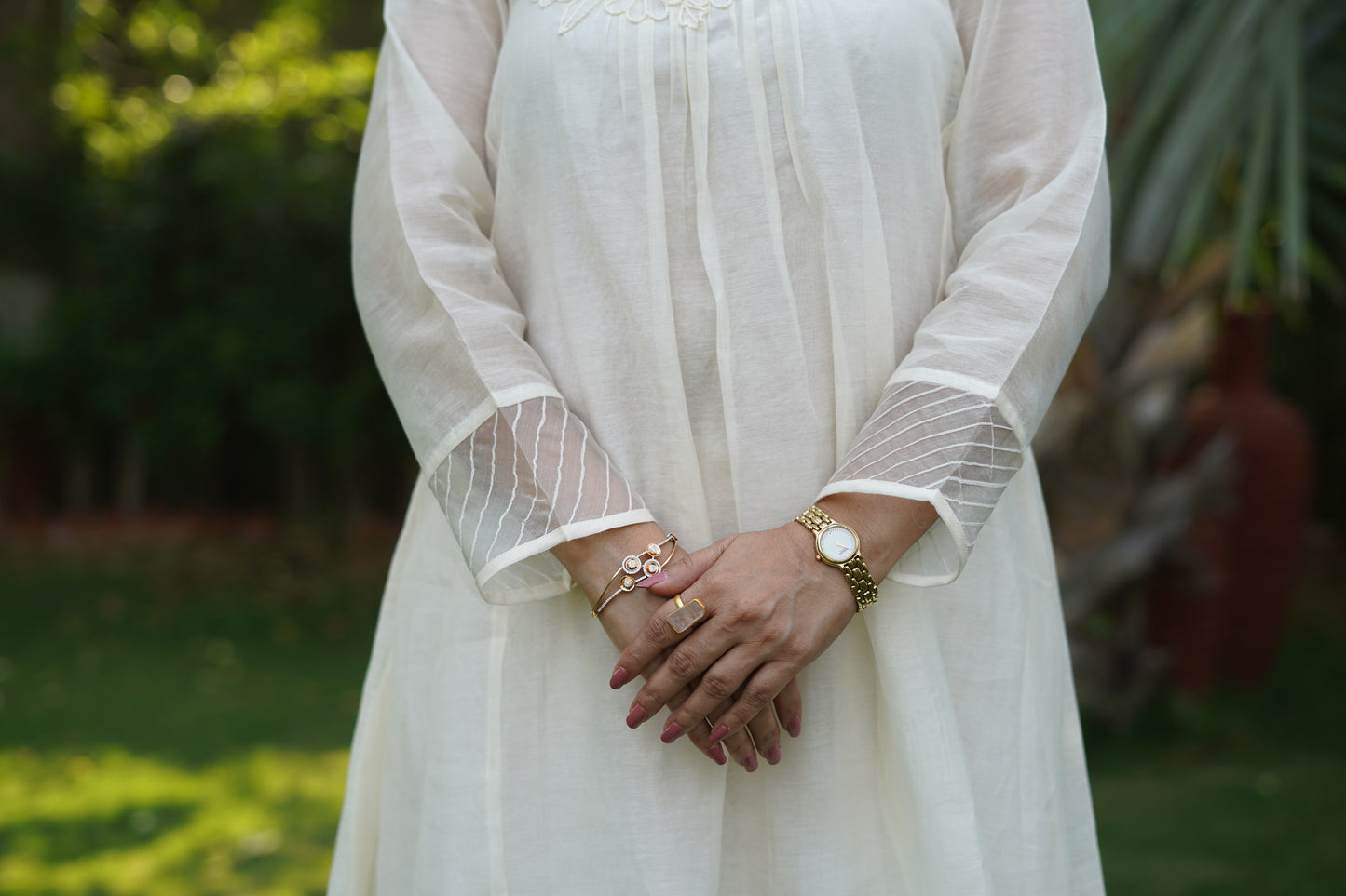 Chanderi kurta and pant with tucks yoke and embosed flower embroidery, organza scalloped flower emb.