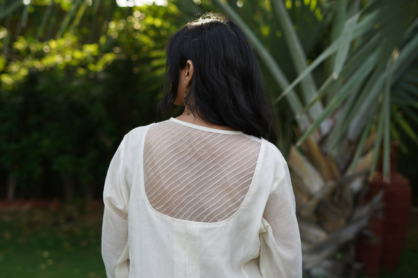 Chanderi kurta and pant with tucks yoke and embosed flower embroidery, organza scalloped flower emb.