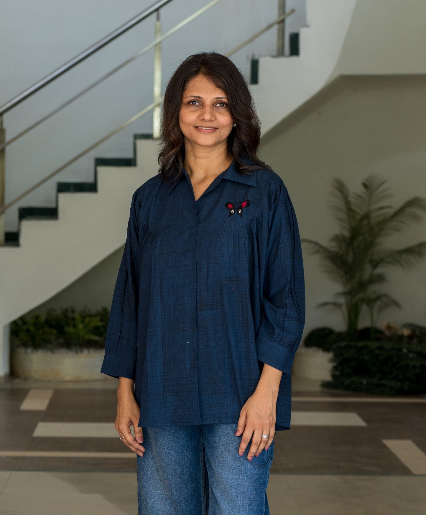 Shirt with embroidered butterfly