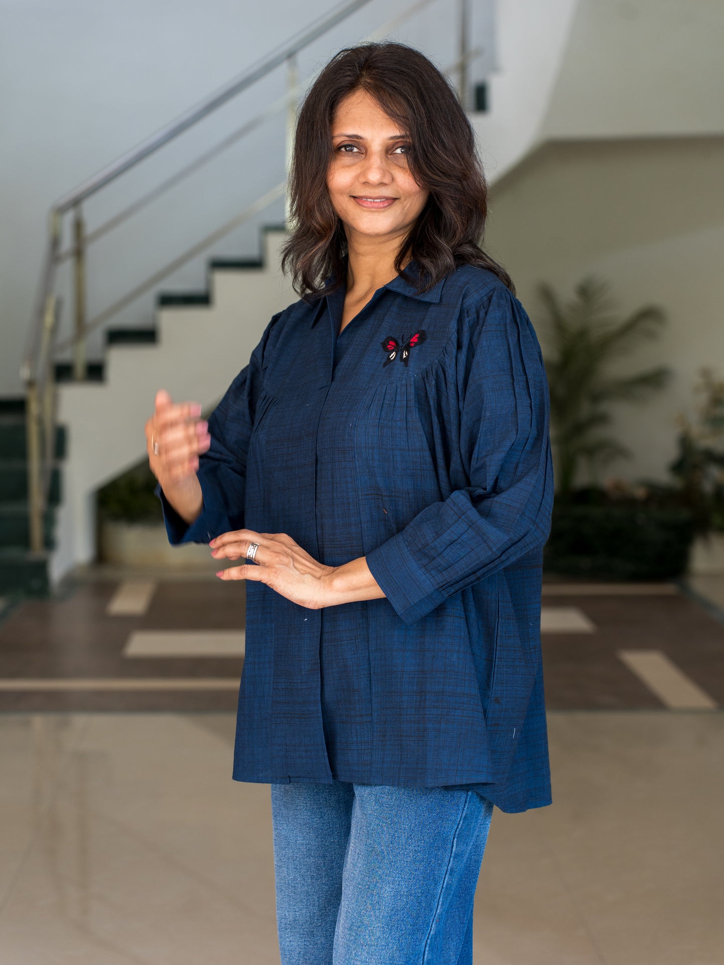 Shirt with embroidered butterfly
